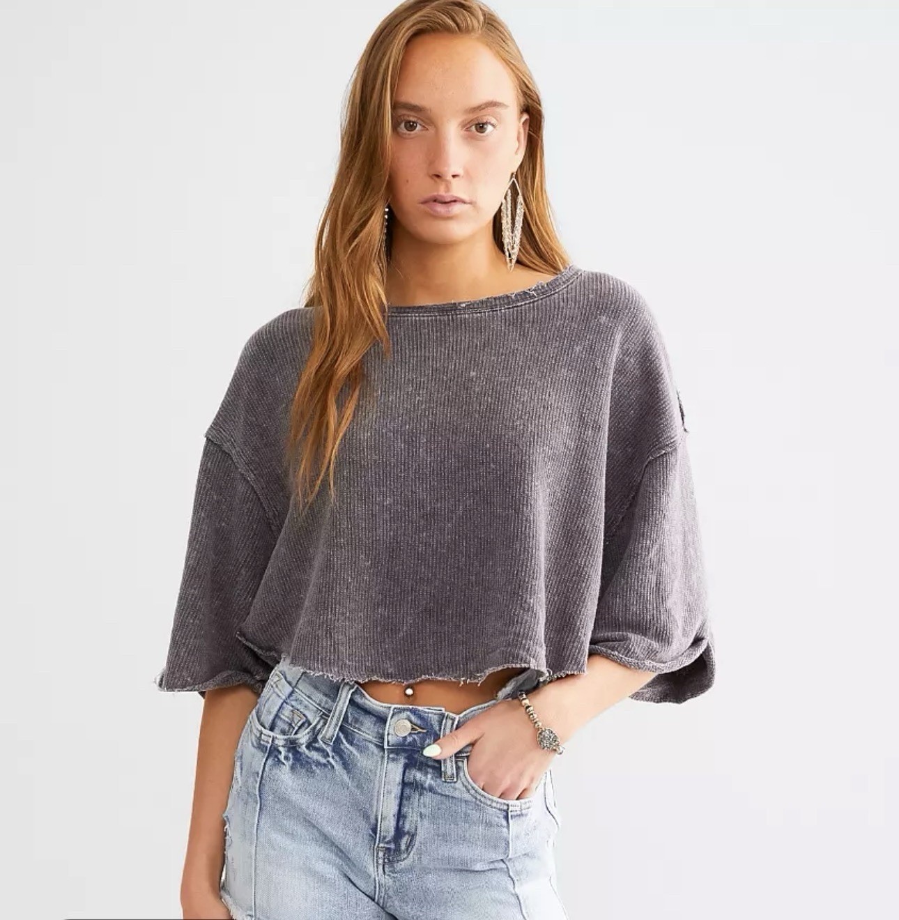 Free People “Off My Mind” cropped t-shirt slouchy, dolman with a raw-edge hem.