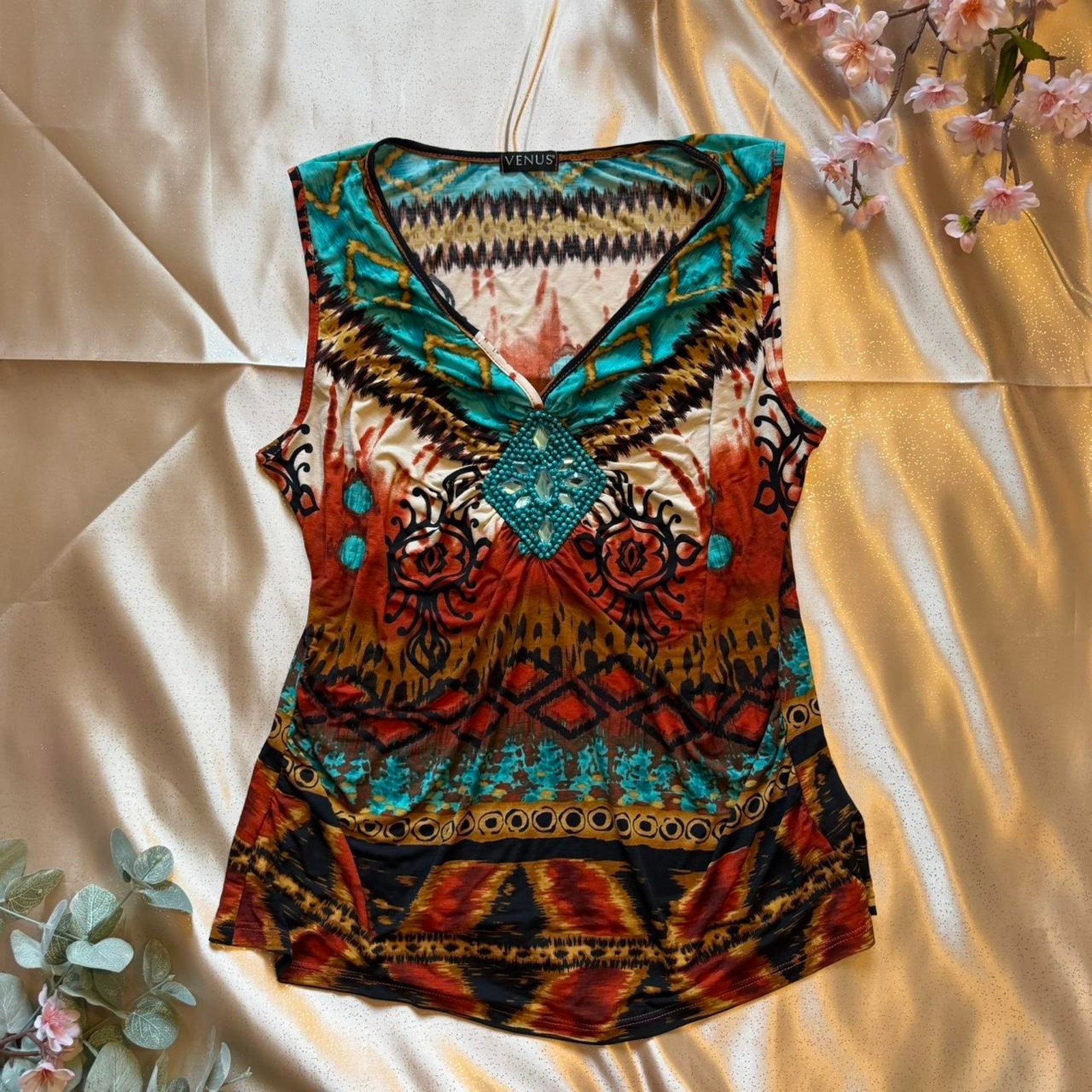Boho Multi colored top with a teal beaded center piece