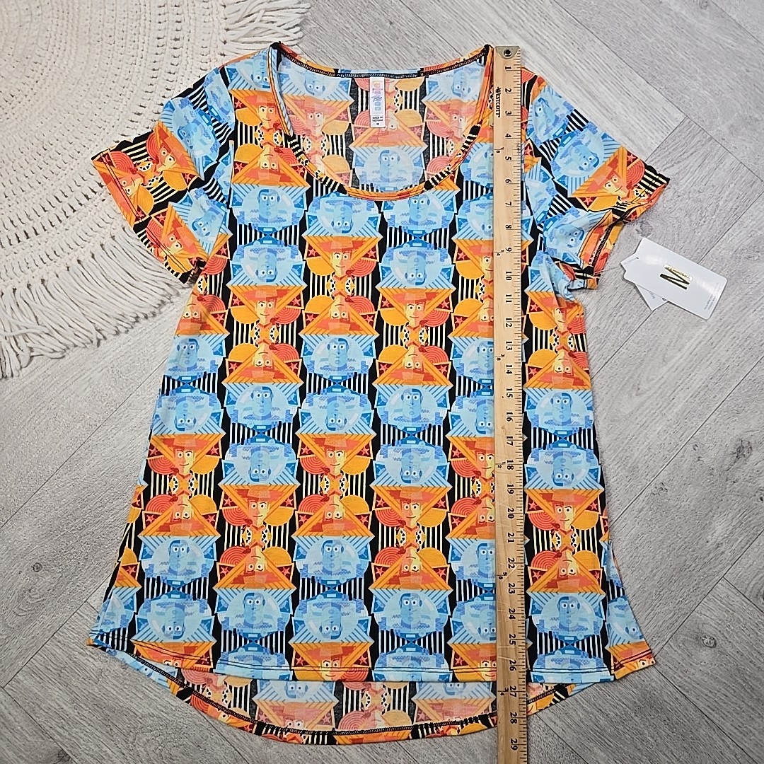 New! LuLaRoe Medium Disney’s Toy Story Buzz Lightyear Woody Shirt Blouse