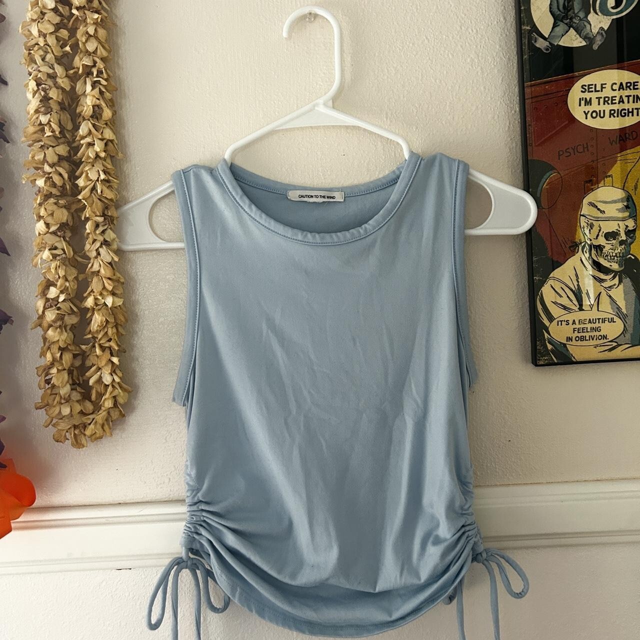 caution to wind blue tank with side tied cutouts