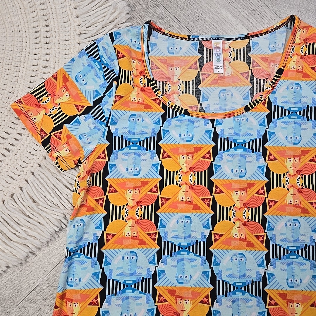 New! LuLaRoe Medium Disney’s Toy Story Buzz Lightyear Woody Shirt Blouse