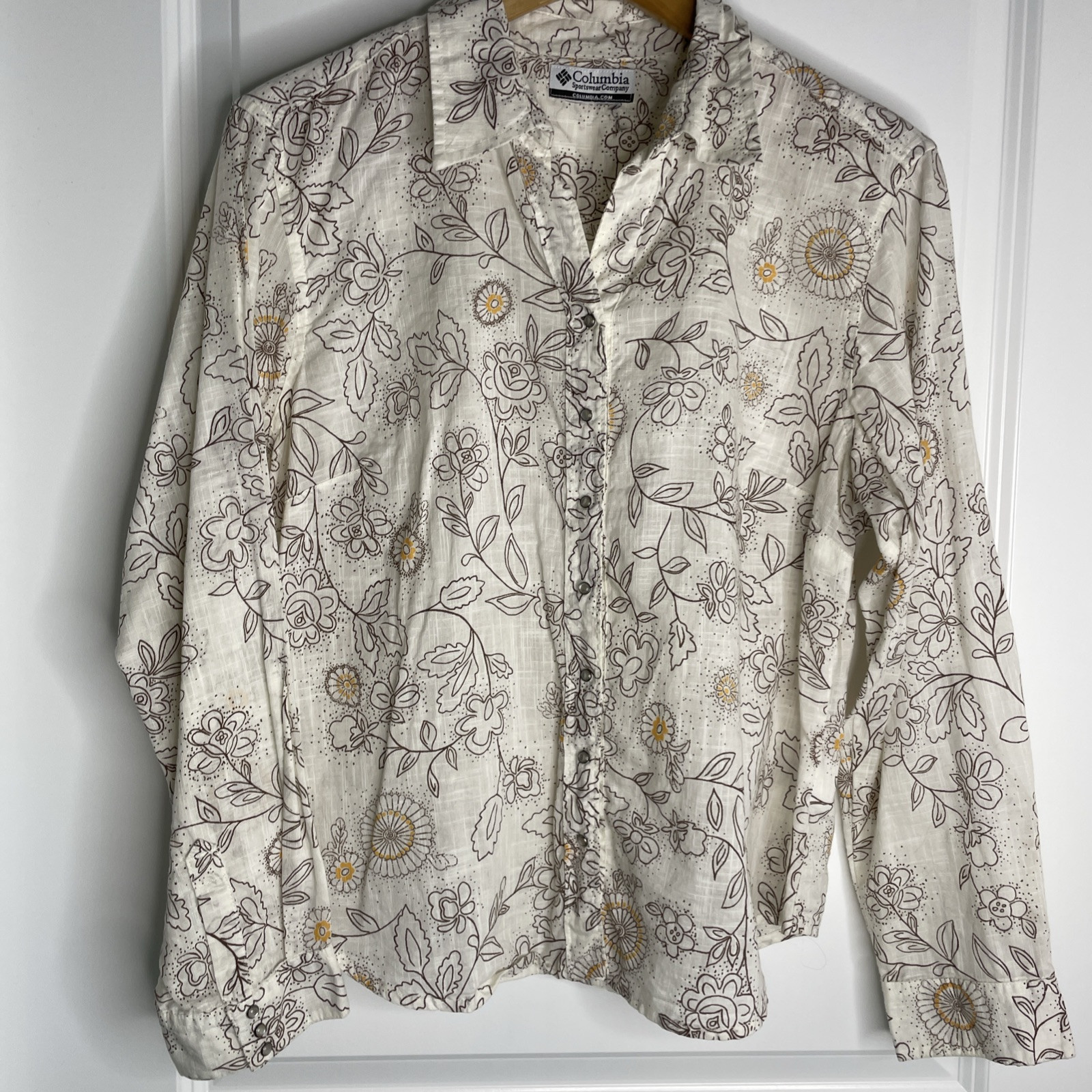 Columbia sportswear Company women’s long sleeve pearl snap collared floral Top