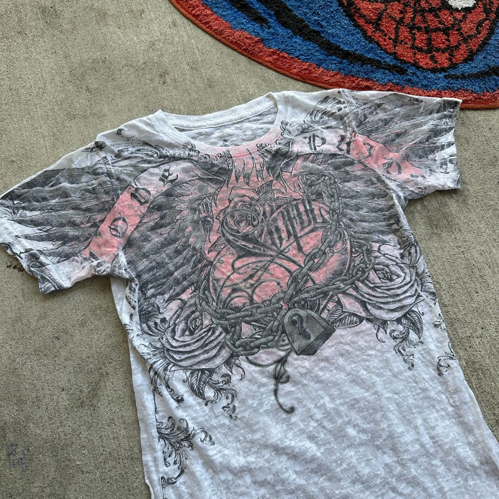 Sinful by Affliction Women’s Graphic T-Shirt with Wings and Lock Design