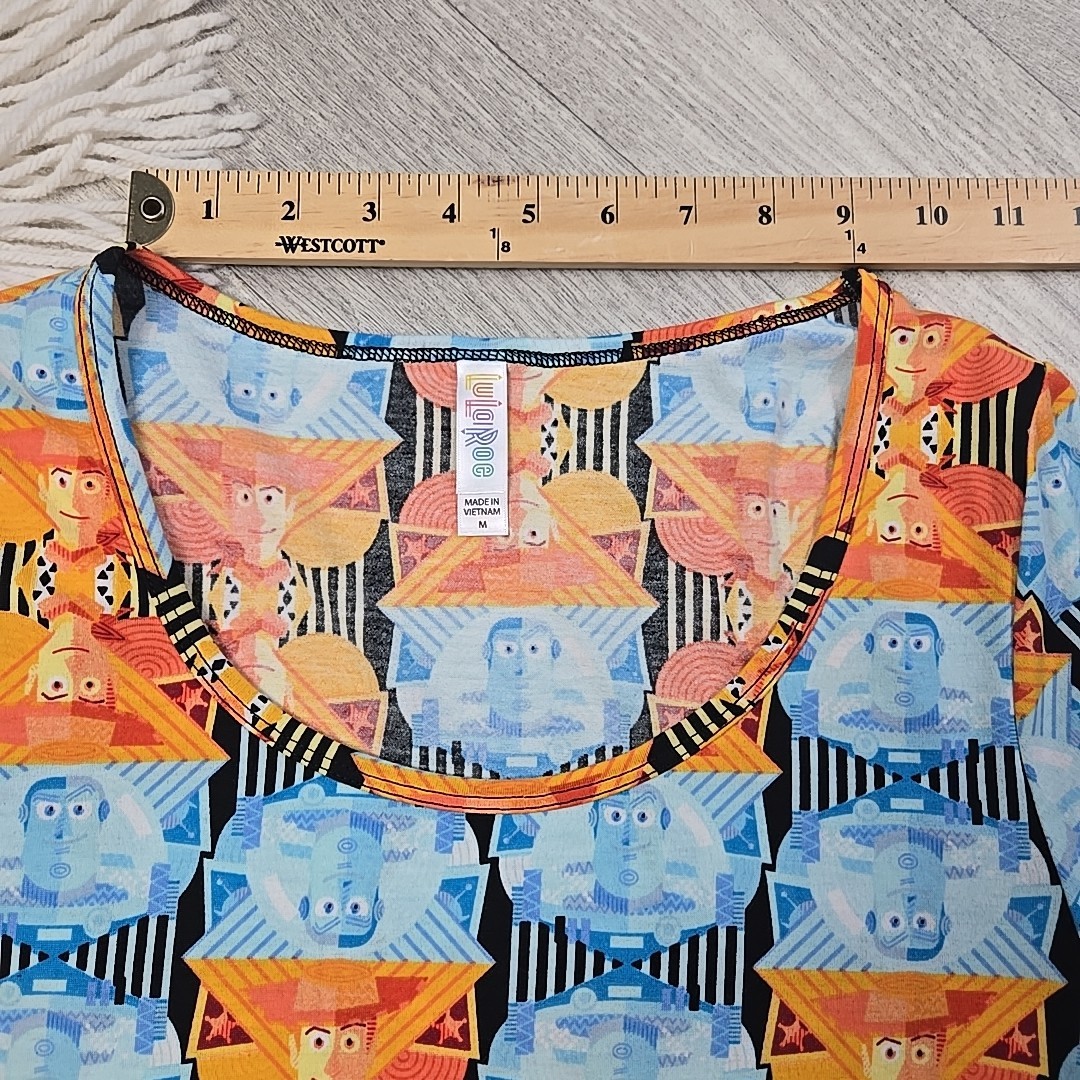 New! LuLaRoe Medium Disney’s Toy Story Buzz Lightyear Woody Shirt Blouse