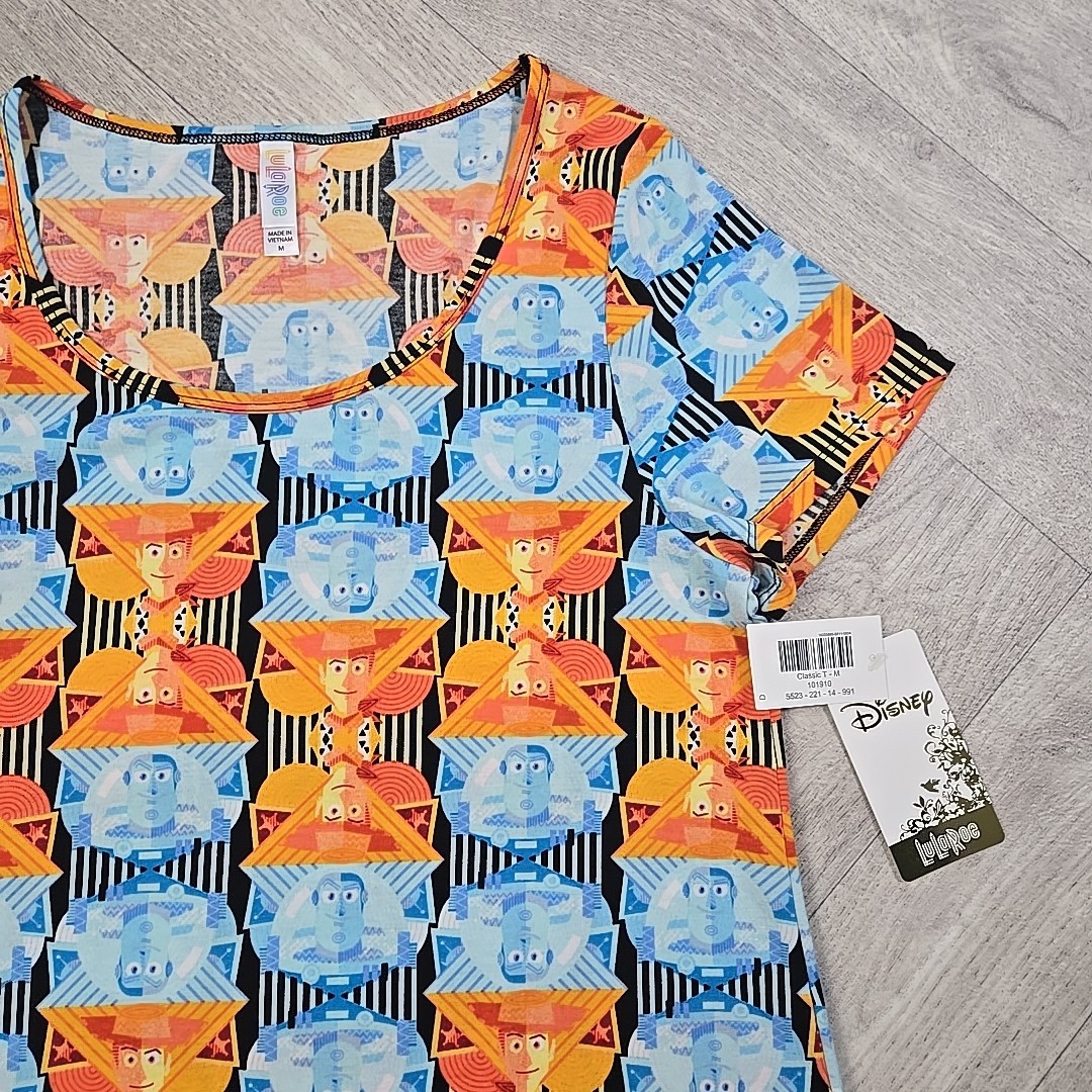 New! LuLaRoe Medium Disney’s Toy Story Buzz Lightyear Woody Shirt Blouse