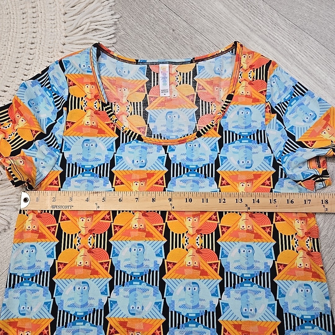 New! LuLaRoe Medium Disney’s Toy Story Buzz Lightyear Woody Shirt Blouse