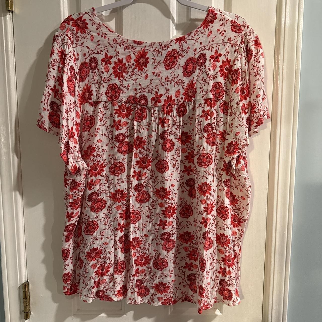 Red and white floral blouse