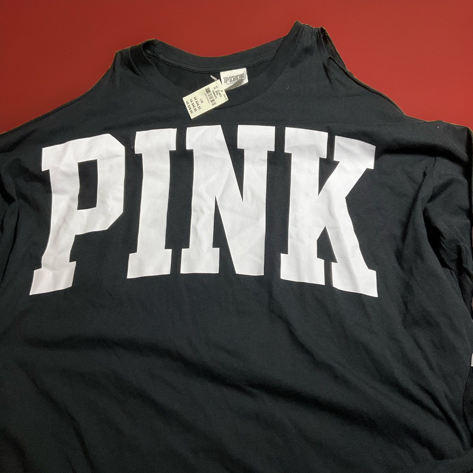 NWT VS pink open shoulder black logo long sleeve top size L