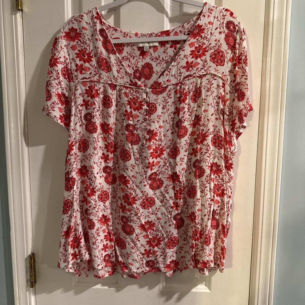 Red and white floral blouse