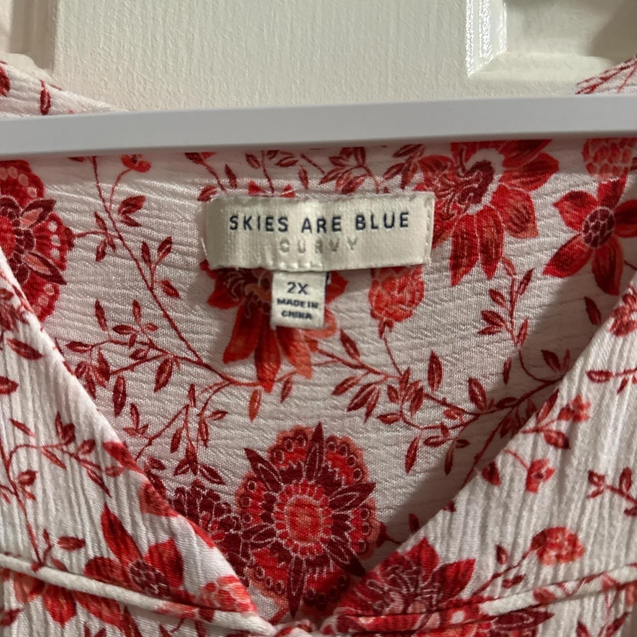 Red and white floral blouse